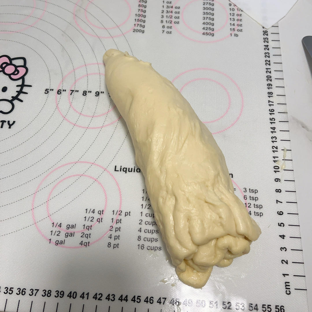 Rolling the dough round into a cone spiral