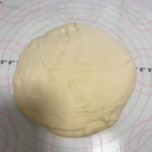 Pressing the chilled dough into a flat disc