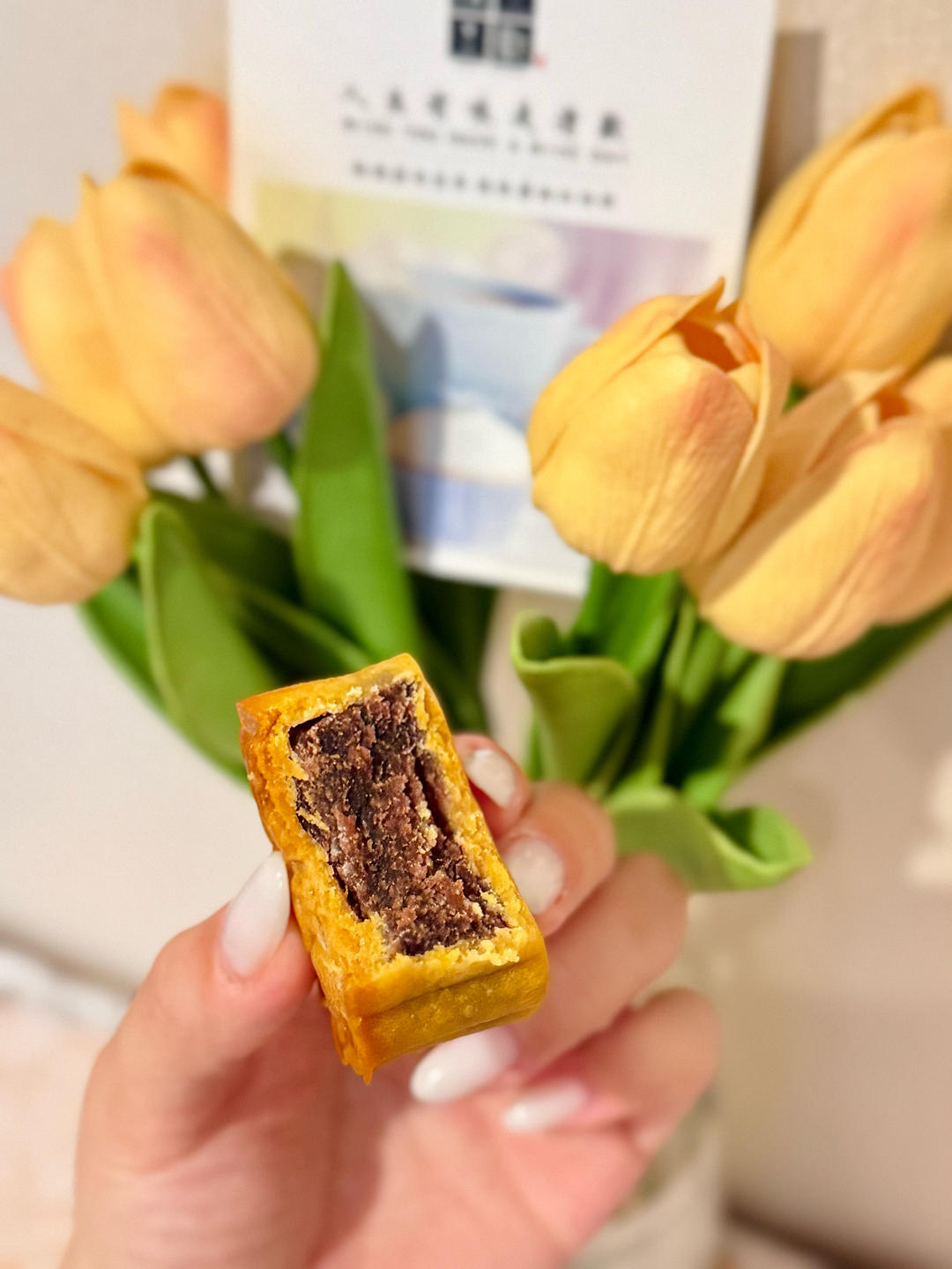 Mooncake cut open to show red bean filling