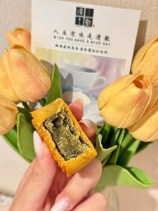 Mooncake cut open to show mung bean filling