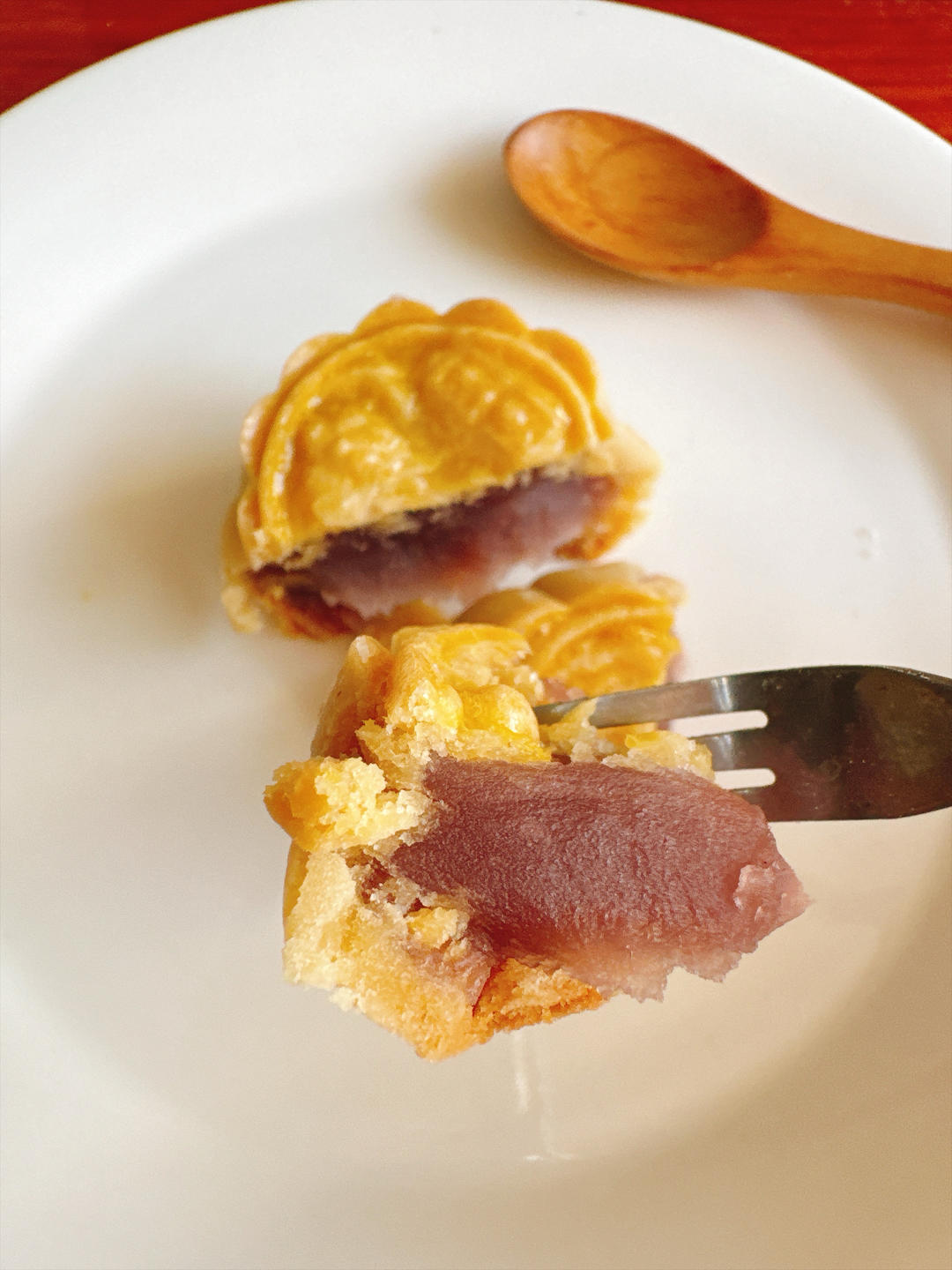 Mooncake cut open to show purple taro filling