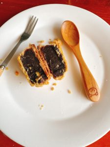 Mooncake cut open to show black sesame filling