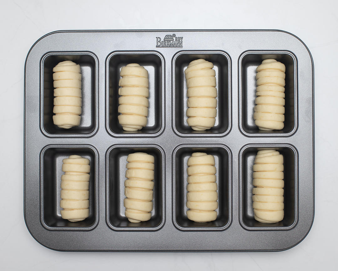 Roll each piece into a tongue shape