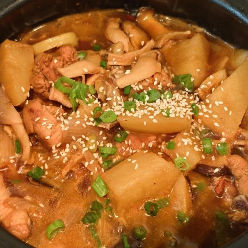 Chicken Stew with Mushrooms served in a clay pot