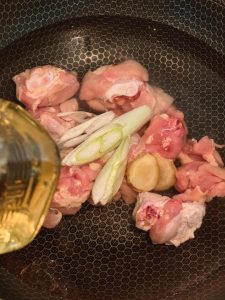 Blanching chicken in a pot