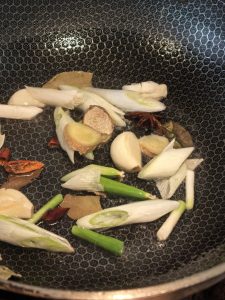 Aromatics blooming in a wok