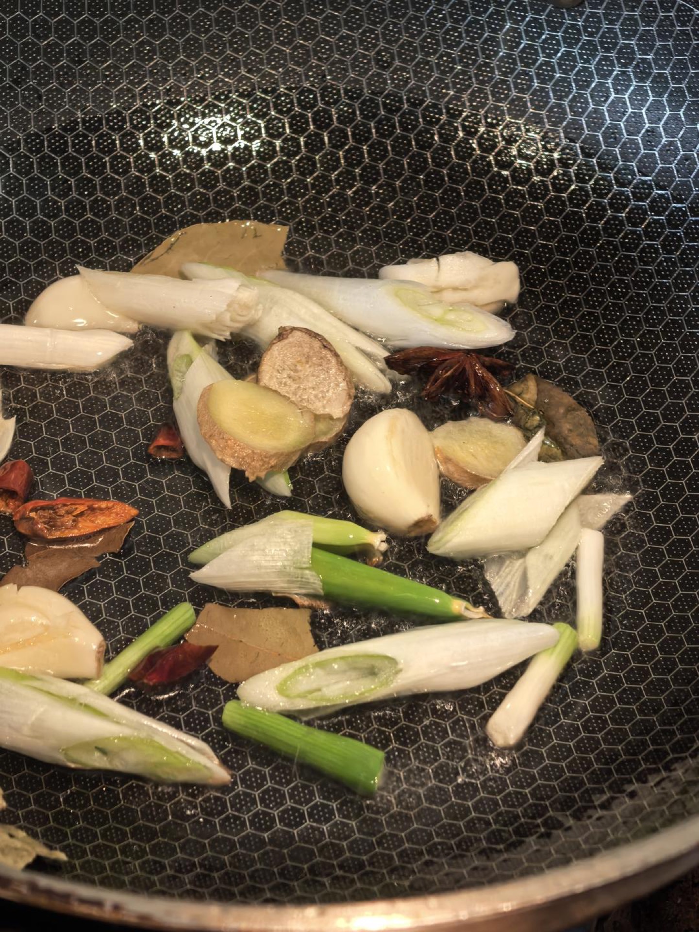 Aromatics blooming in a wok