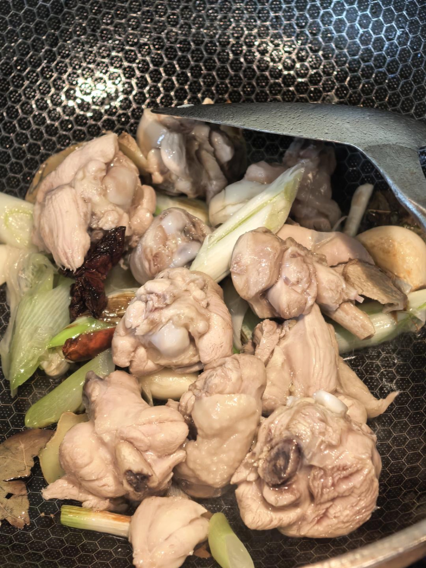 Chicken pieces searing in the wok