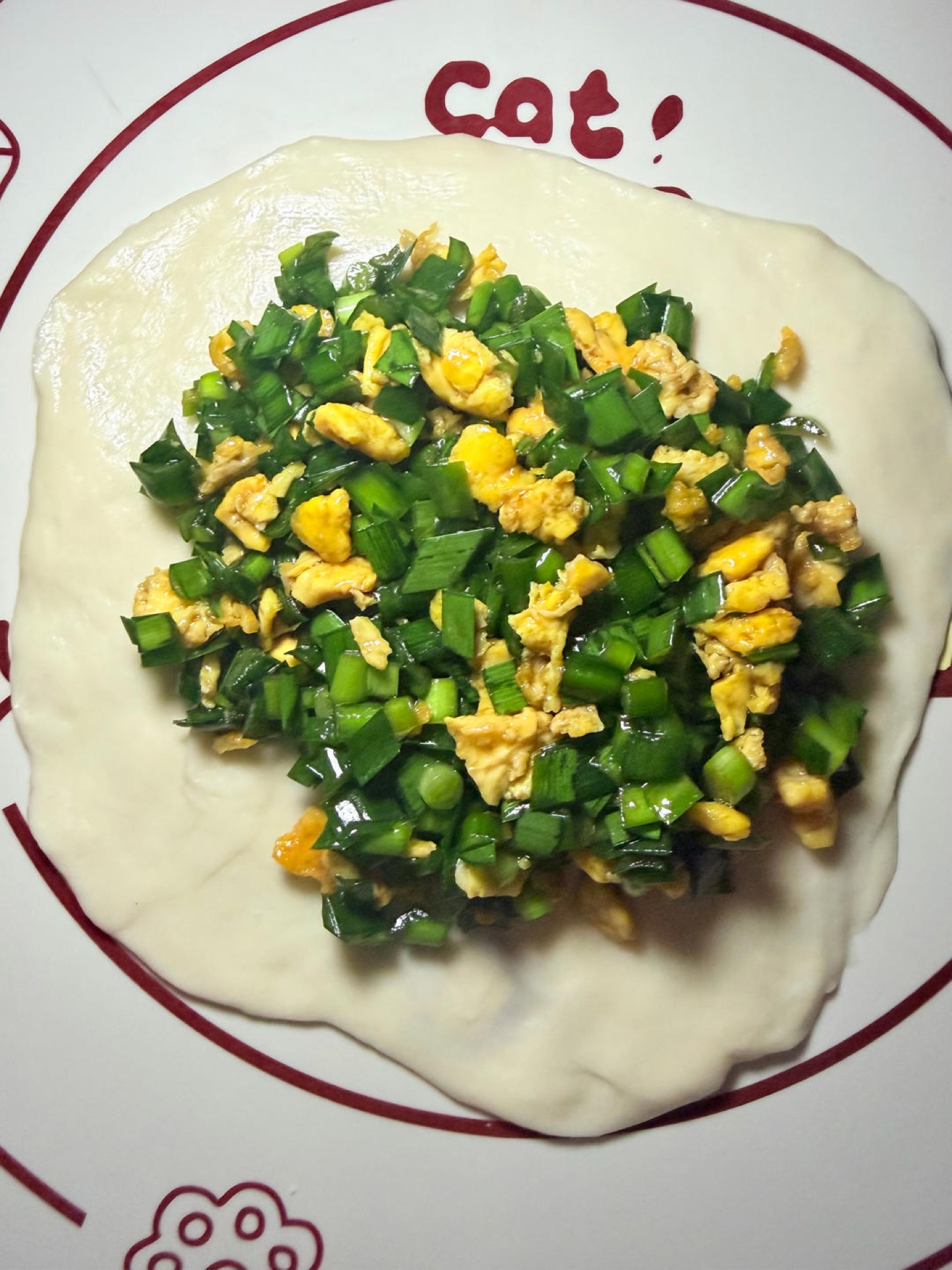 Place a generous amount of the chive and egg filling in the center and pinch the dough closed tightly.