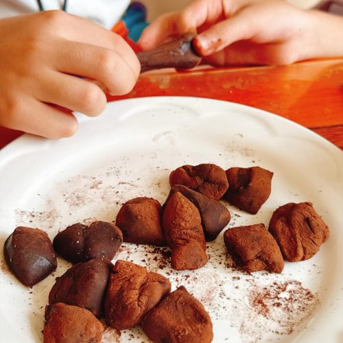 Chewy chocolate mochi bites dusted with cocoa powder