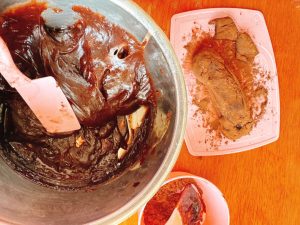 Mochi dough rolled in cocoa powder