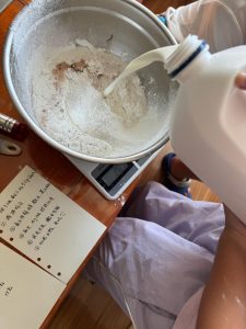 Milk poured into the dry ingredients