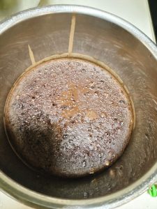 Fork testing the steamed mochi dough