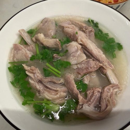 Clear stewed lamb soup with tender lamb ribs in a clear savory broth, finished with chopped cilantro