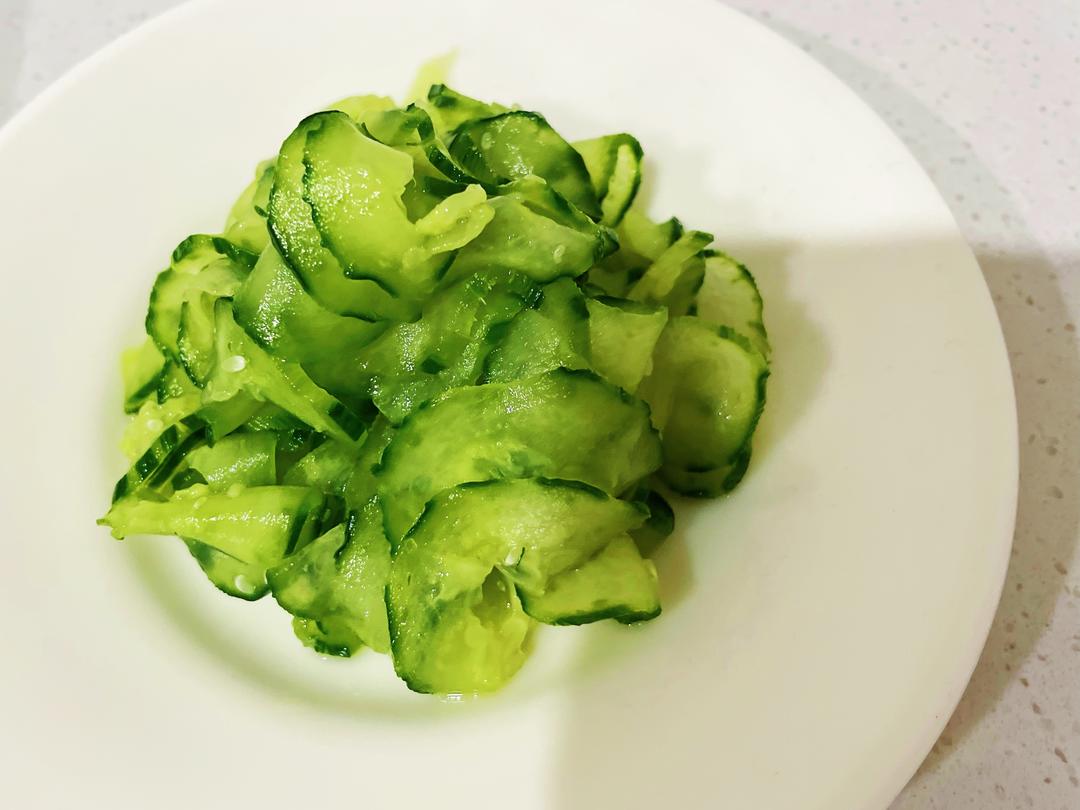 Squeeze the cucumber slices dry, toss with th