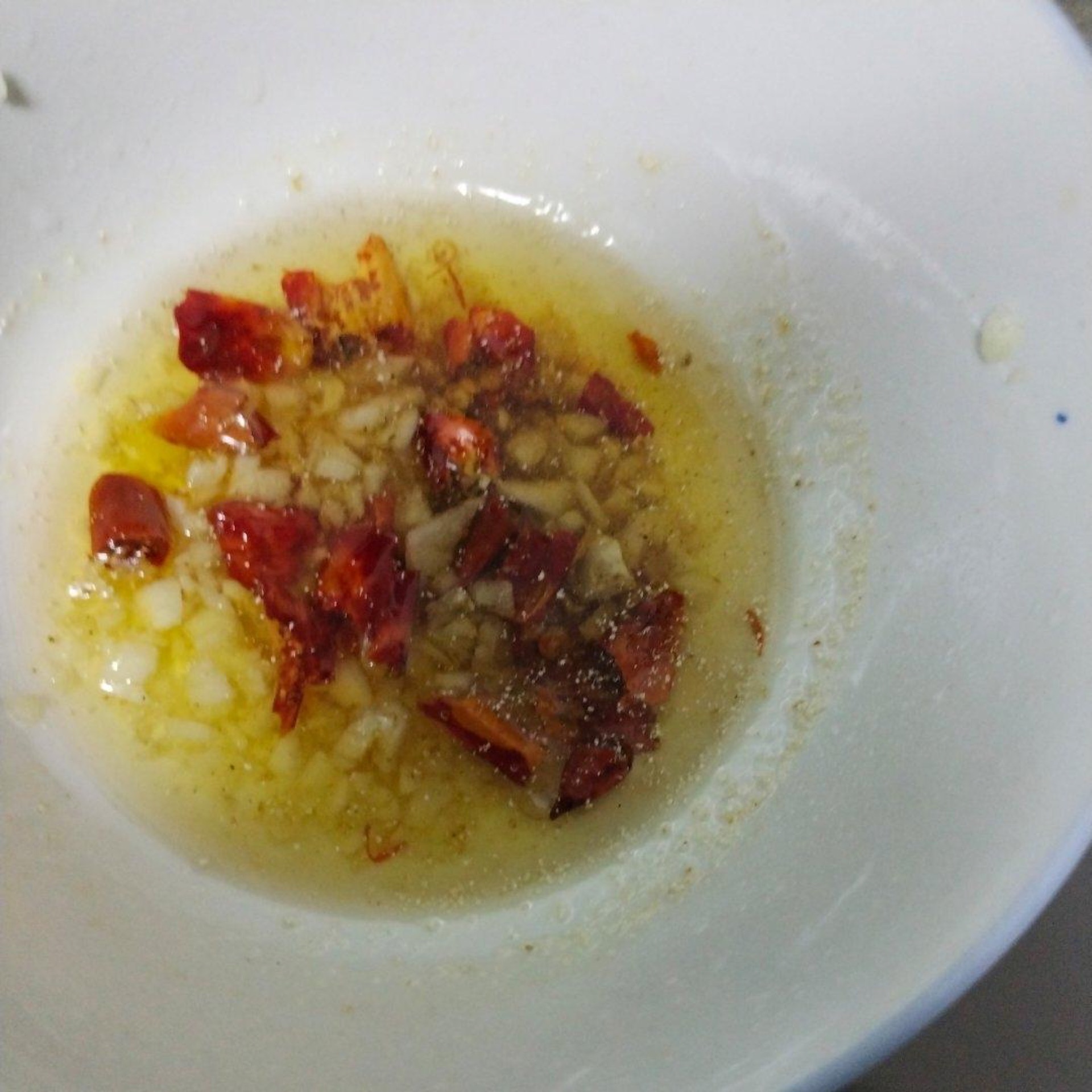 Heat the oil until it just smokes and pour it over the aromatics to bloom them.