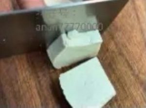 Thick slices of firm tofu on a board