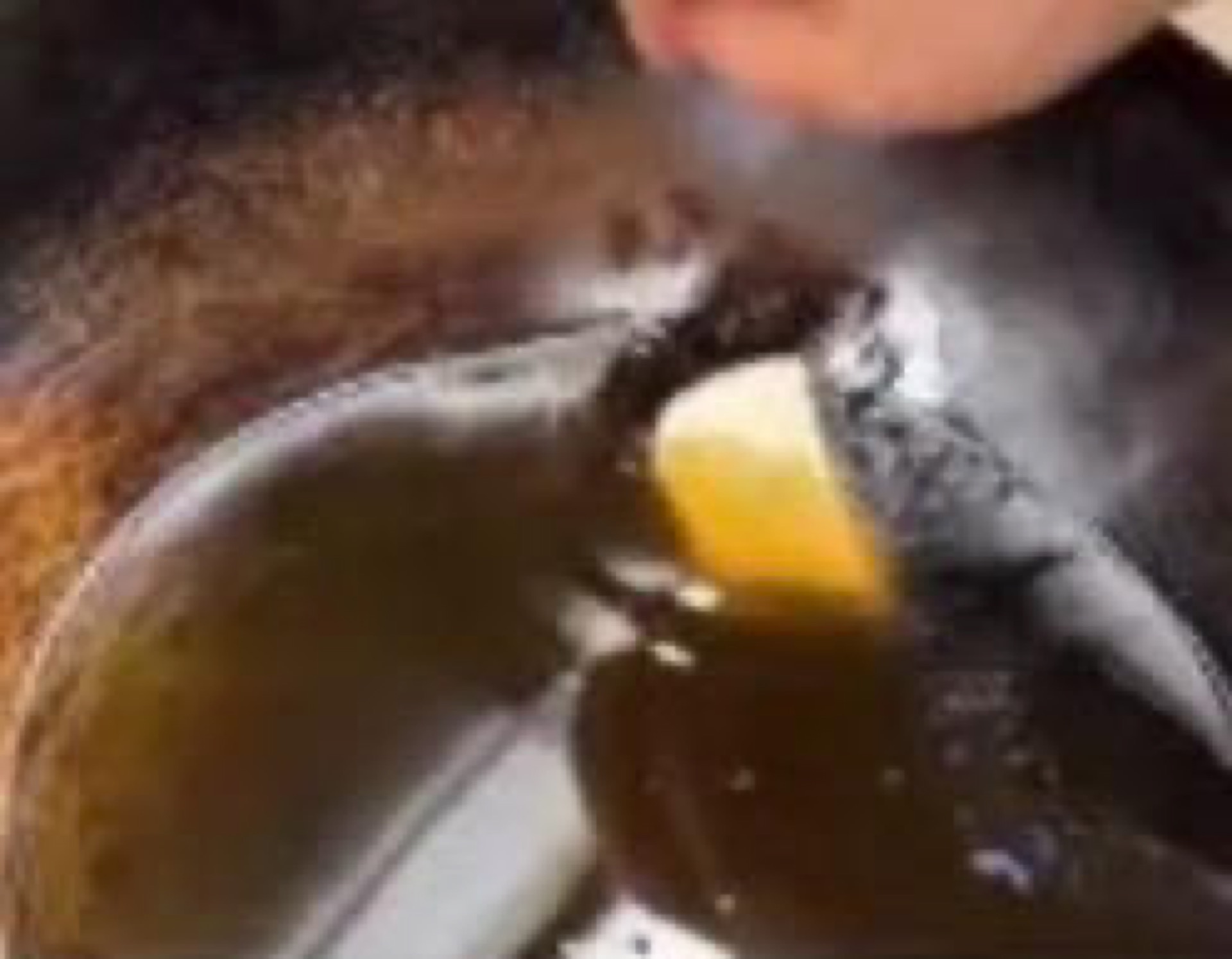 Tofu frying in hot oil until golden