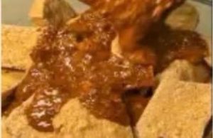Sauce poured over crispy fried tofu