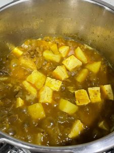 Simmer over low heat for 10 minutes until the potato is tender.