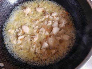 Add boiling water until it comes level with the chicken, then simmer over medium heat for 10 minutes.