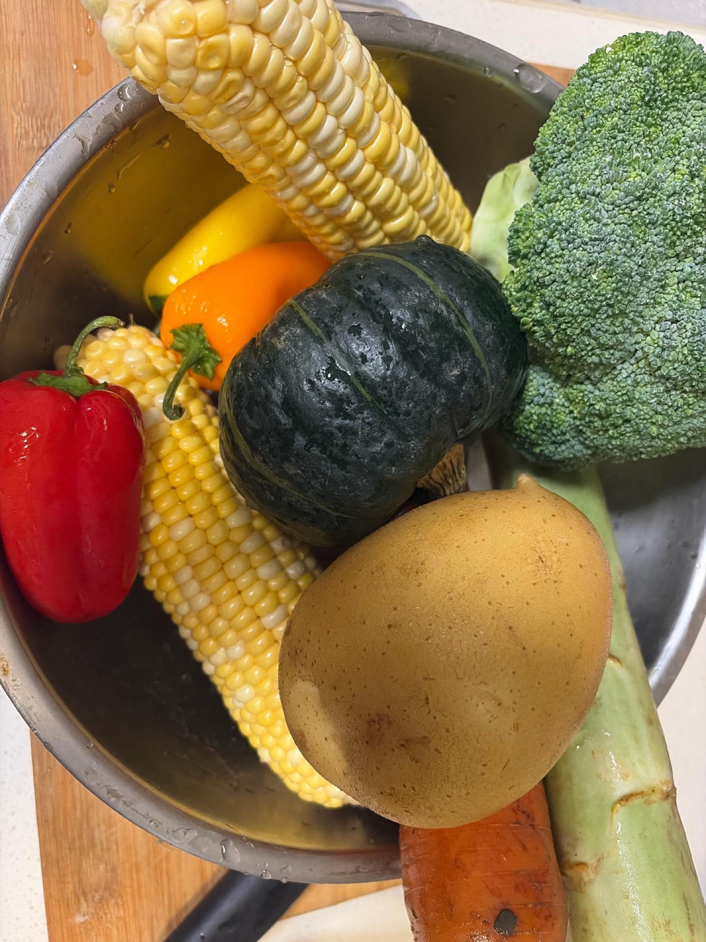 Washed and peeled vegetables for diet meal prep laid out on a cutting board