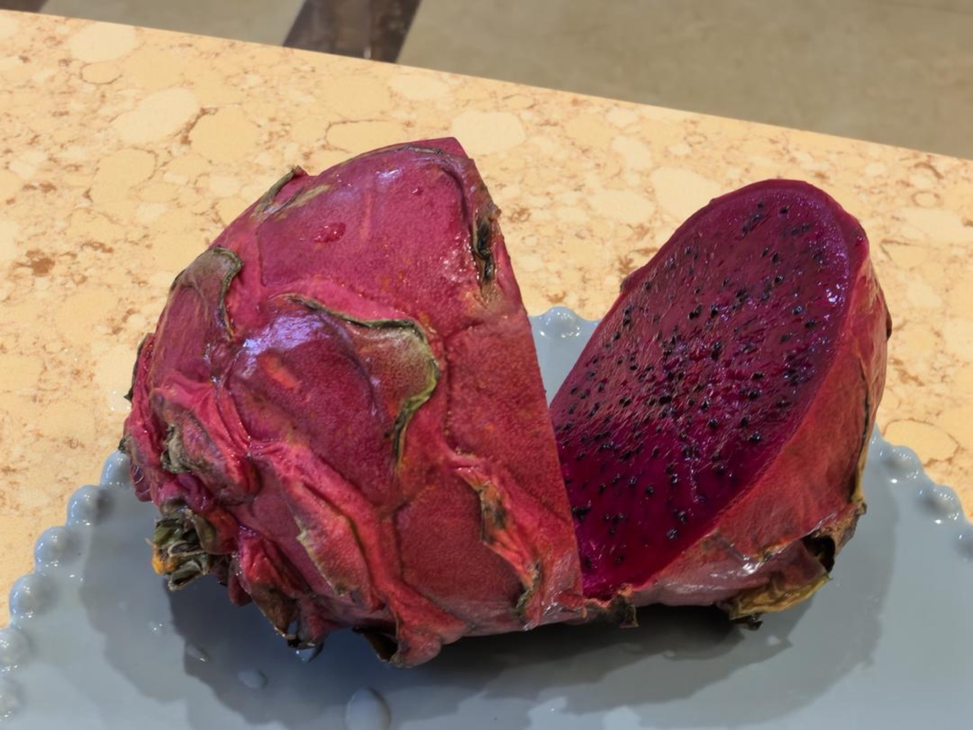 Diced red dragon fruit on a cutting board