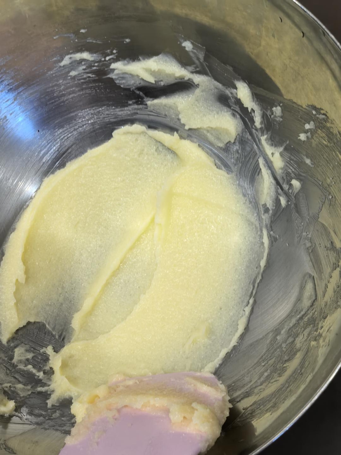 Butter and sugar creamed together in a bowl