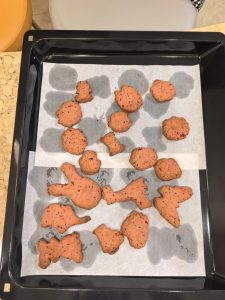 Finished pink dragon fruit cookies on a plate