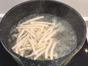 Wash the seafood mushrooms and blanch them in boiling water.