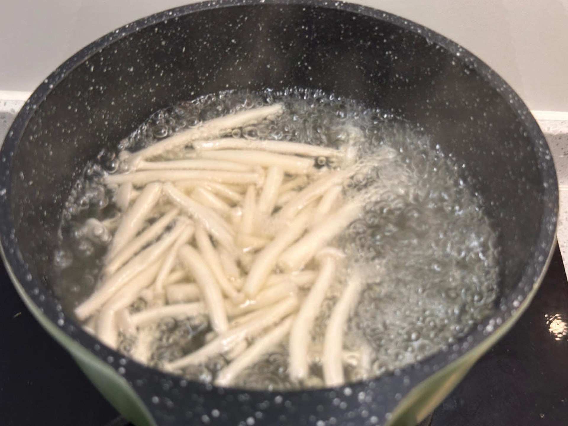 Wash the seafood mushrooms and blanch them in boiling water.