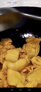 Wipe the wok, heat it until it is smoking lightly, add the marinated pork belly, and stir-fry over medium-high heat until the slices render their fat and the edges turn golden and
