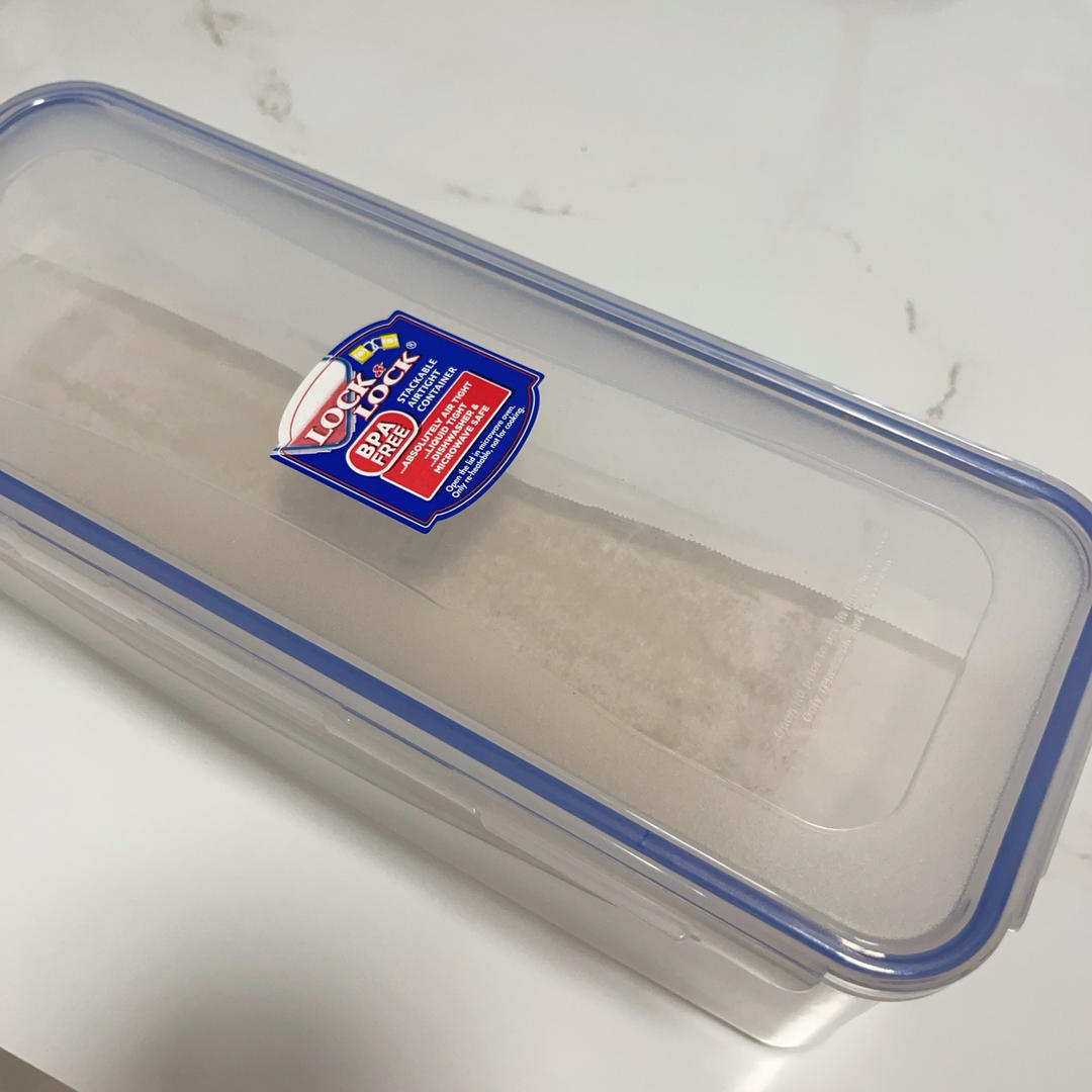 The rolled cake chilling in a box as a rolling frame