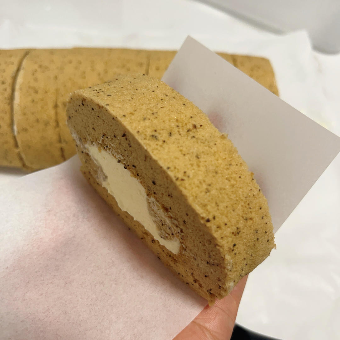 Slices of roll cake wrapped in parchment paper