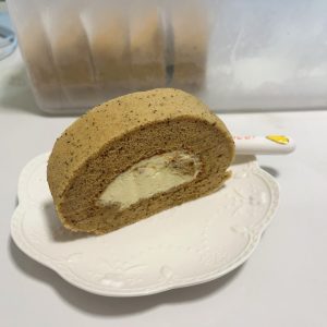 Perfectly sliced earl grey roll cake on a plate