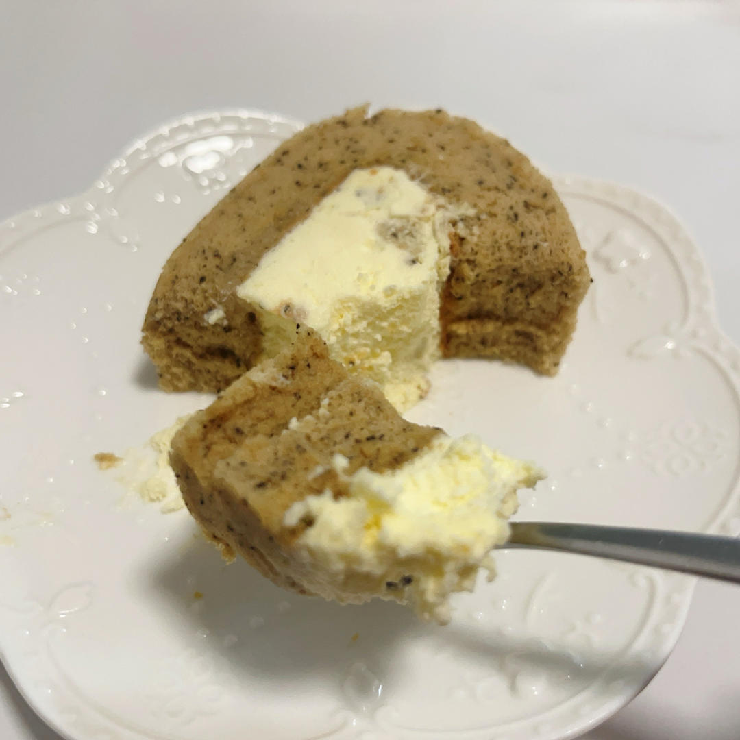 A slice of earl grey roll cake ready to enjoy