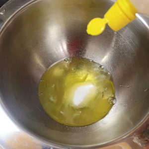 Egg whites being whipped with sugar and lemon juice