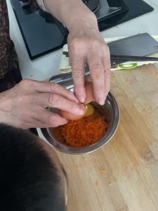 Crack one egg into the bowl with the carrot and beat it in with a whisk or chopsticks until the yolk and white are completely combined.