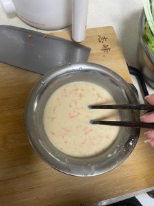 Stir the batter until it is completely smooth and no dry flour pockets or lumps remain, then let it rest for 10 minutes so the flour hydrates.
