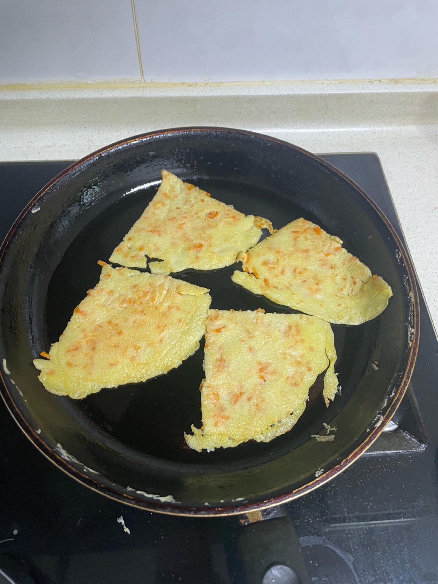 Slide the pancake onto a cutting board and cut it into small squares or strips that are easy for little hands to pick up, then repeat with the remaining batter — each pancake takes