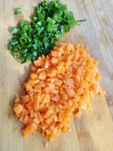 Chop the scallions finely and dice the carrot into tiny pieces