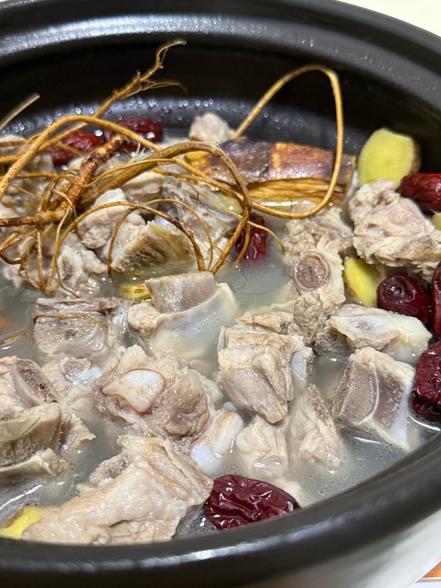Five-Finger Peach Pork Rib Soup in a clay pot with tender ribs and red dates