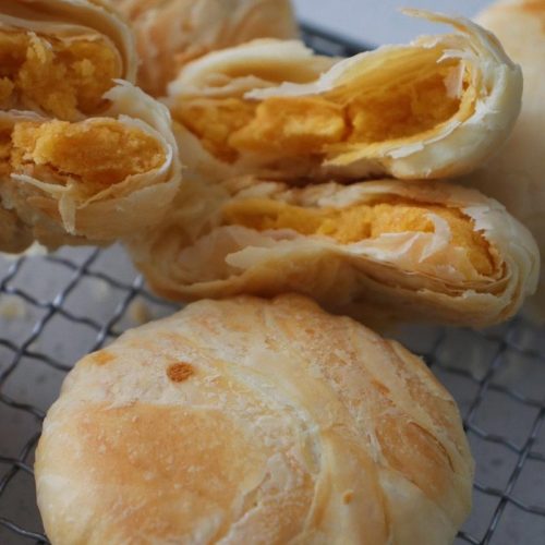 Craggy flaky Huangzhuang mooncakes with golden salted egg yolk filling