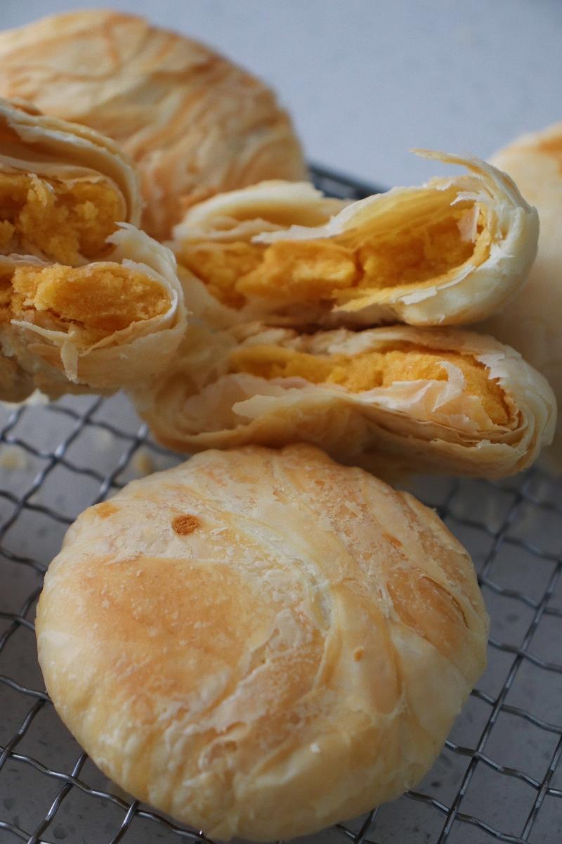 Craggy flaky Huangzhuang mooncakes with golden salted egg yolk filling
