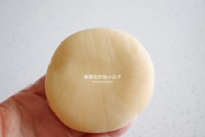 Mooncake with an irregular textured surface ready for baking