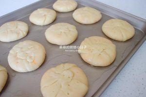 Poking small holes in the mooncake tops with a bamboo skewer