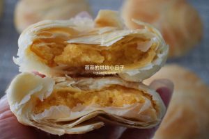 Broken mooncake showing fine flaky pastry layers