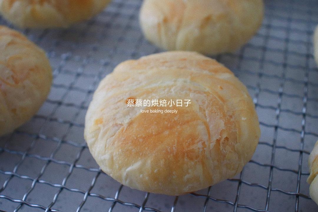 Stack of flaky mooncakes on a plate