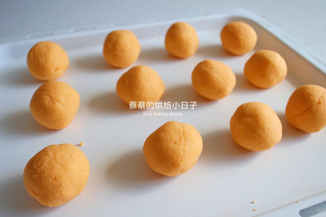 Rolling the yolk bean paste filling into twelve balls