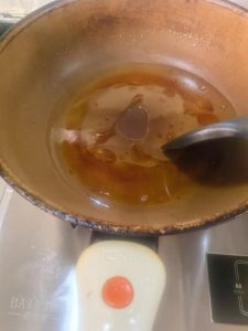 Sugar melting into caramel in the wok